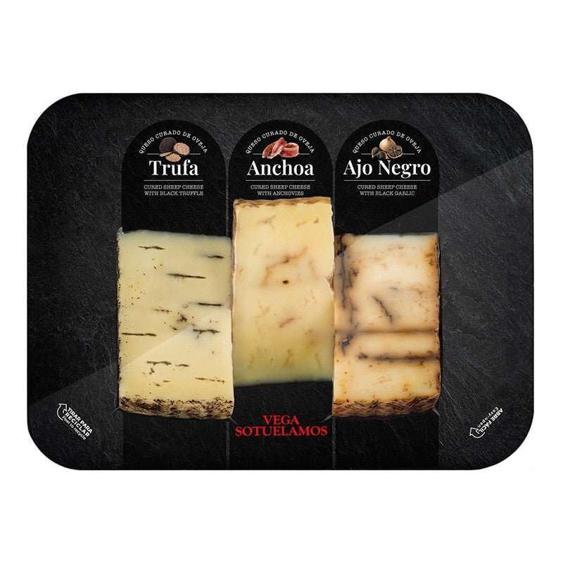 Board with wedges of Black Truffle, Anchovies and Black Garlic