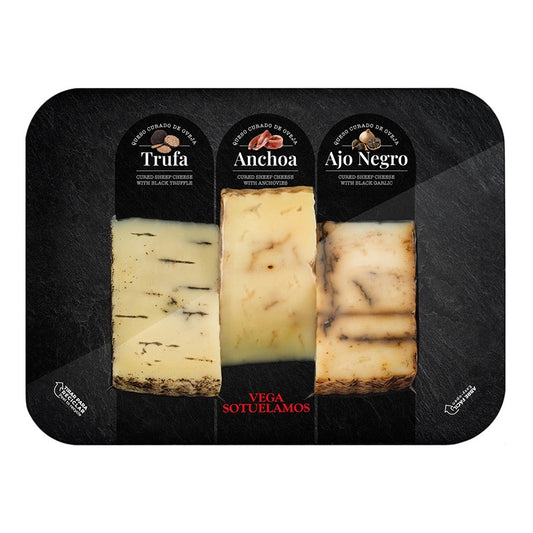 Board with wedges of Black Truffle, Anchovies and Black Garlic